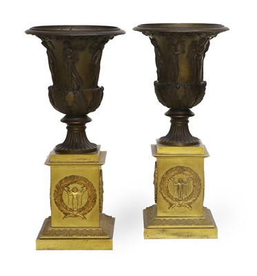 Lot 249 - A Pair of Gilt and Patinated Bronze Urns, in...