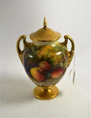 Lot 198 - A Royal Worcester twin handled pedestal vase, decorated with fruit, signed Moseley, with cover...