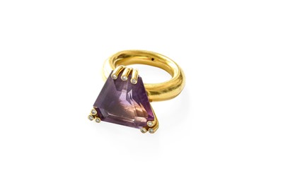 Lot 424 - An Amethyst and Diamond Ring, the fancy...