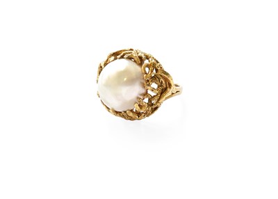 Lot 390 - A Mabe Pearl Ring, the mabe pearl within a...