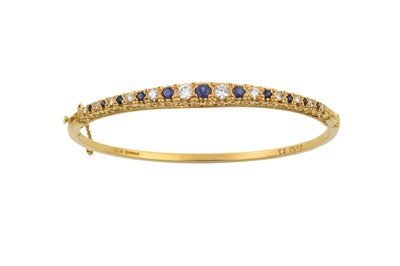 Lot 2249 - An 18 Carat Gold Sapphire and Diamond Bangle...