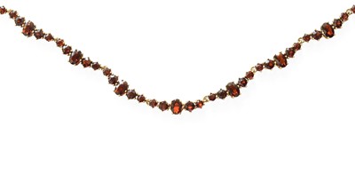 Lot 394 - A 9 Carat Gold Garnet Necklace, set throughout...