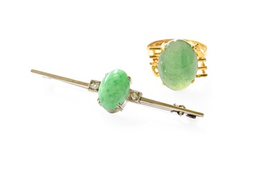 Lot 375 - A Jade and Diamond Brooch, the oval cabochon...