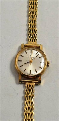 Lot 210 - A 9ct gold Omega ladies watch on a 9ct gold Rolex bracelet