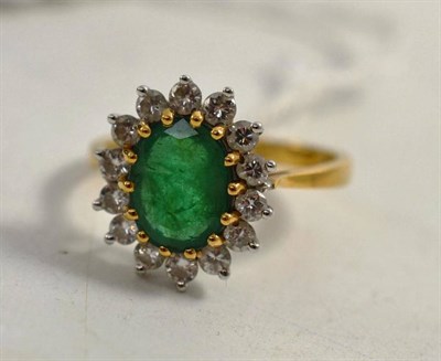 Lot 218 - An emerald and diamond ring