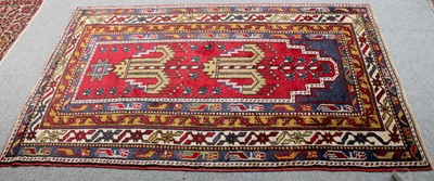 Lot 1112 - Turkish Mujur Prayer Rug, the deep raspberry...