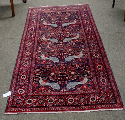 Lot 1101 - Afghan Rug, the midnight blue field with a one-...