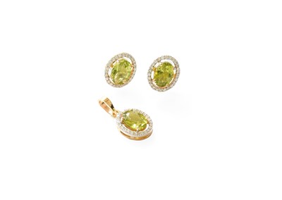 Lot 410 - A Pair of 18 Carat Gold Peridot and Diamond...