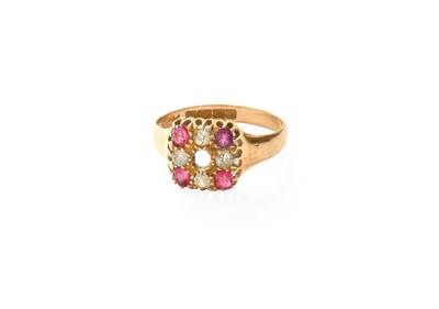 Lot 362 - An 18 Carat Gold Ruby and Diamond Cluster Ring,...