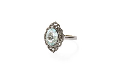 Lot 412 - An Aquamarine and Diamond Ring, the oval cut...