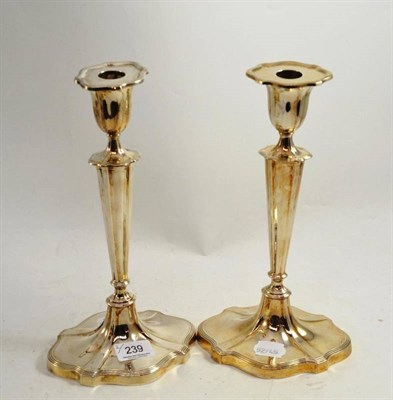 Lot 239 - A pair of Walker & Hall silver candlesticks