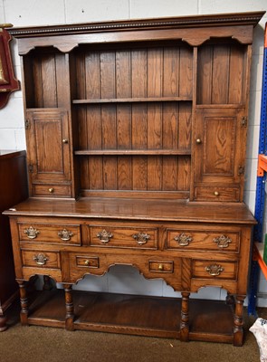 Lot 1374 - An 18th Century Style Oak Enclosed Dresser and...