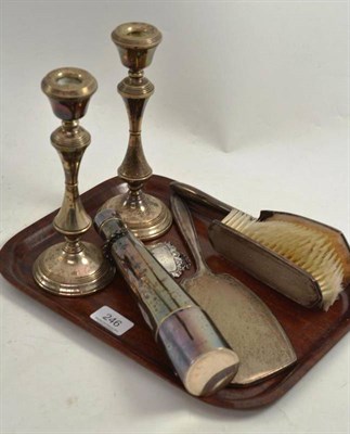 Lot 246 - A pair of silver candlesticks, silver mounted dressing table set, silver spirit label and a flask