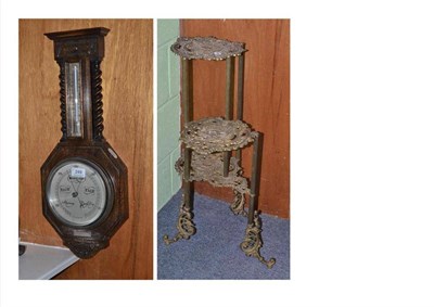 Lot 249 - An aneroid barometer and a plant stand