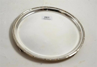 Lot 261 - A Dutch white metal circular salver on four knurl feet, 23cm diameter