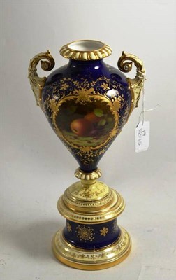 Lot 263 - A Coalport blue and gilt decorated pedestal vase with fruit painted panel