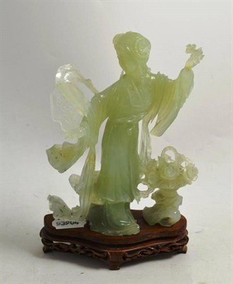 Lot 268 - A circa 1960s Chinese jade-type carved maiden on wood stand