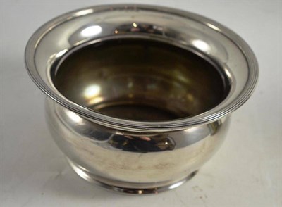 Lot 271 - A George V plain bowl, Birmingham 1913, with reeded everted rim and cushion compressed body,...