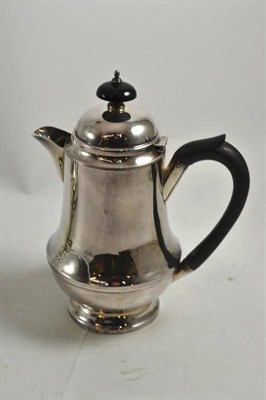 Lot 273 - A George VI hot water jug, maker's mark ALD, Birmingham 1938, a baluster shape with domed cover and