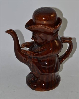 Lot 301 - A treacle glaze Toby teapot