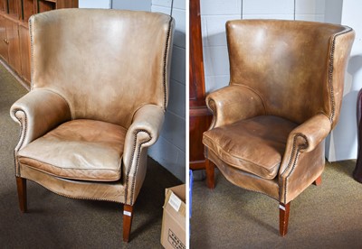 Lot 1285 - A Pair of Wing Back Studded Leather Chairs, in...