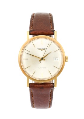 Lot 2186 - Longines: A 9 Carat Gold Automatic Calendar...