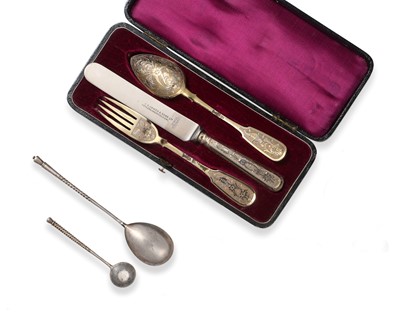 Lot 83 - A Russian Silver-Gilt Knife, Fork and Spoon,...