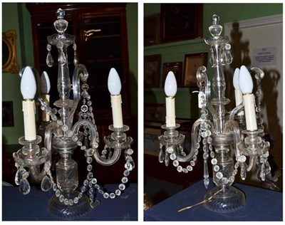 Lot 329 - A pair of cut glass three branch table light fittings with faceted drops