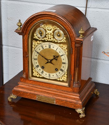 Lot 1386 - A German Oak Quarter Striking Mantel Clock,...