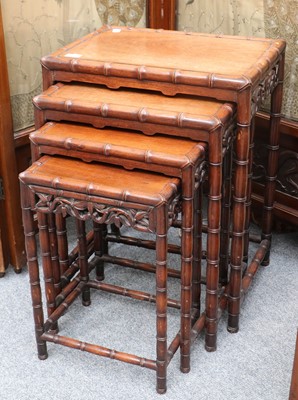 Lot 1386 - A Nest of Four Chinese Hardwood Tables, carved...