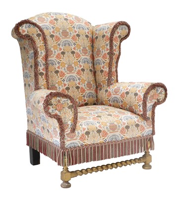 Lot 707 - A Late Victorian Wing Armchair, upholstered in...