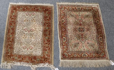 Lot 1227 - Hereke Silk Rug, the cream ground of flowers...