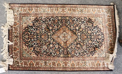 Lot 1228 - Kashmir Silk Rug, the indigo field richly...