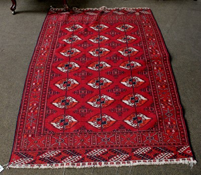 Lot 1102 - Afghan Tekke Rug, the rose pink field with...