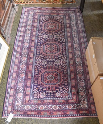 Lot 1165 - Kordi Rug, the charcoal field with three...