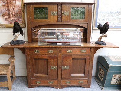 Lot 1235 - An Arts and Crafts Oak Sideboard, the upper...