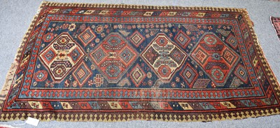 Lot 1143 - Gendje Rug, the deep indigo field with four...