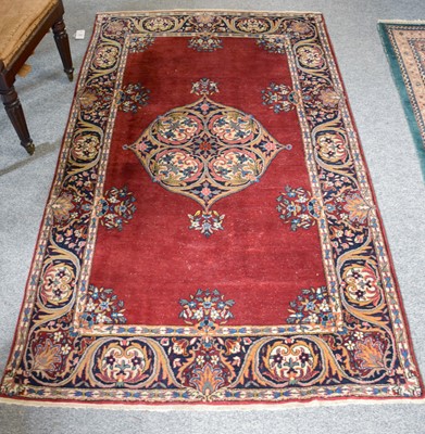 Lot 1152 - Indian Rug, the raspberry field centred by a...