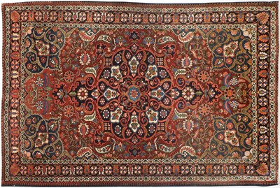 Lot 670 - Bakhtiari Rug West Iran, circa 1940 The deep...