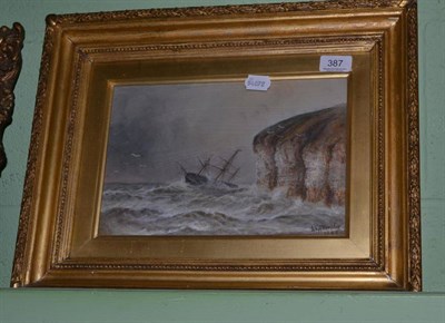 Lot 387 - S J A Allerston, ship foundering off cliffs, oil on canvas