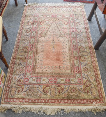 Lot 1139 - Kayseri Prayer Rug, the salmon pink field...