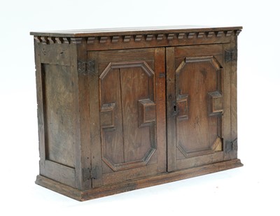 Lot 629 - An Oak Geometric Moulded Wall Cupboard, the...