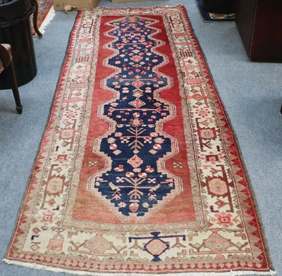 Lot 1174 - North West Persian Runner, the faded...