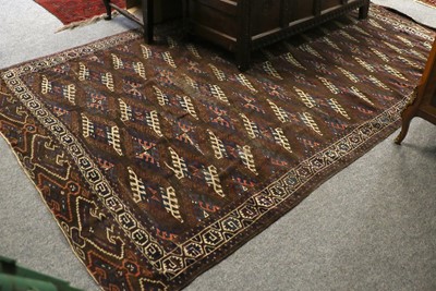 Lot 1159 - Yomut Carpet, the chocolate brown field with...