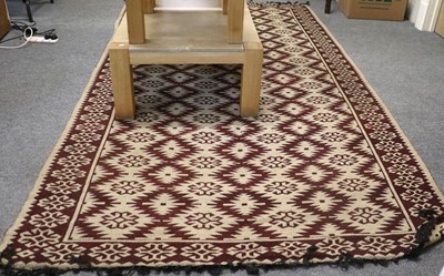 Lot 1126 - Anatolian Kilim, the ivory and pale aubergine...