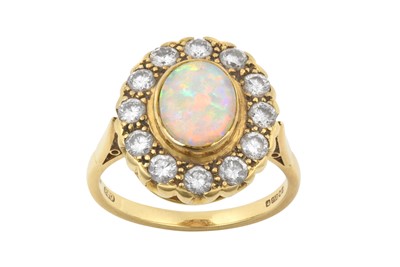 Lot 2253 - An 18 Carat Gold Opal and Diamond Cluster Ring...