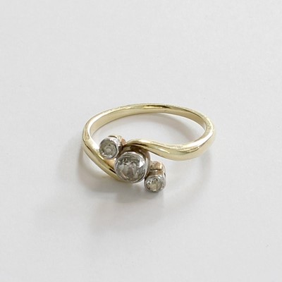 Lot 210 - A Diamond Three Stone Twist Ring, the...