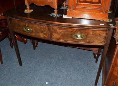 Lot 445 - A mahogany bow front two drawer serving table
