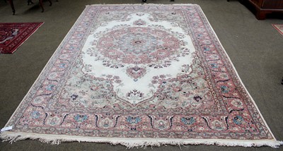 Lot 1104 - Indian Carpet, the cream field with large...