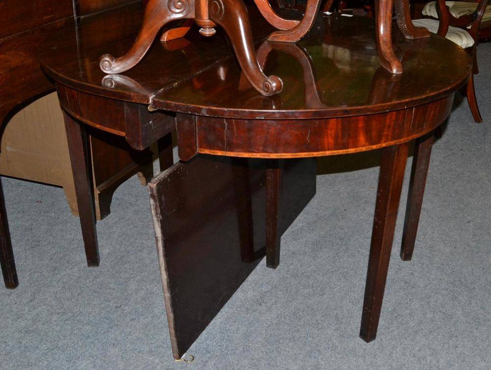 Lot 458 - Georgian mahogany D-end dining table and a leaf